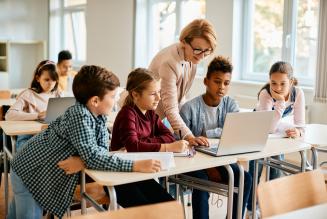 teacher with girls and boys